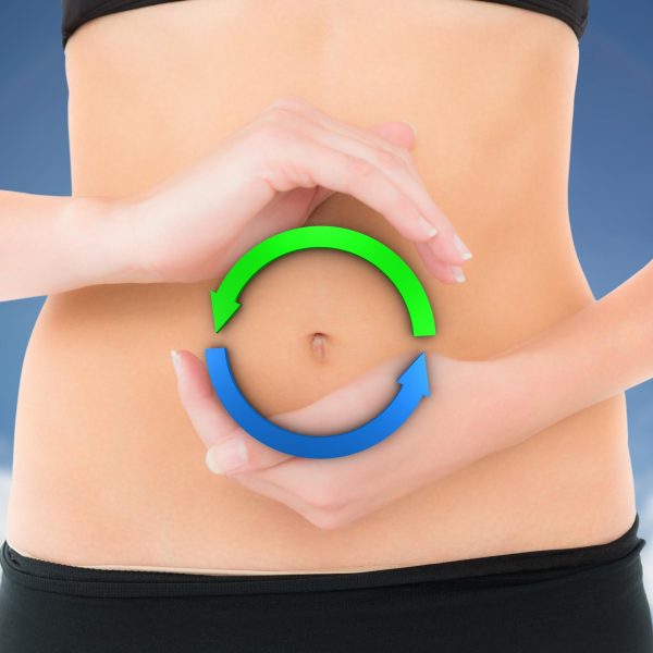 Hands form a circle over a woman's bellybutton to symbolize cleansing waves.