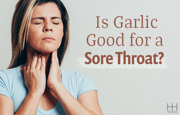 Woman closing her eyes and holding her hands up to her sore throat. 
