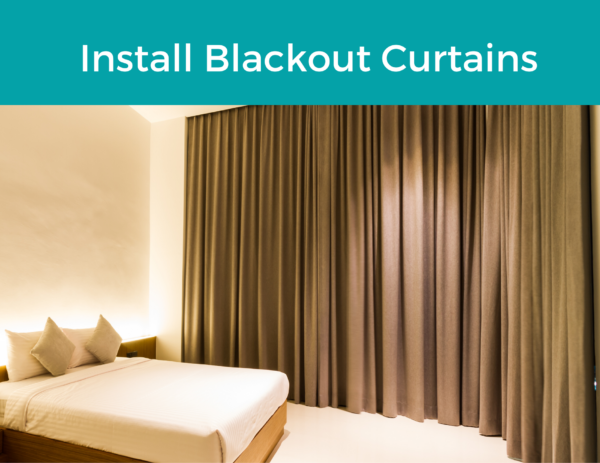 bed surrounded by dark curtains under the title "Install Blackout Curtains" 