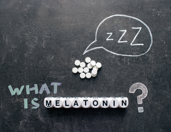 chalkboard with the words "what is melatonin?" under a speech bubble filled with zzz